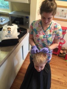 boy being checked for head lice in portland oregon home