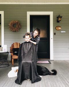 lice removal appointment on seated girl outside