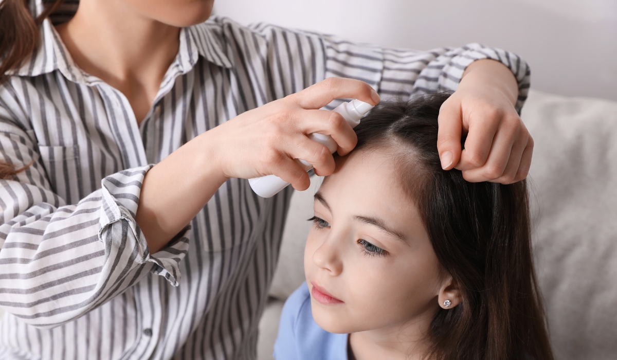 Emergency lice treatment takes place in Seattle during a warm afternoon with focus on a young girl and a caring adult